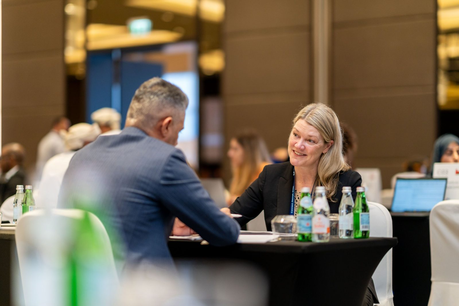 Two delegates in a one-to-one meeting at a previous ICEF scholarship summit